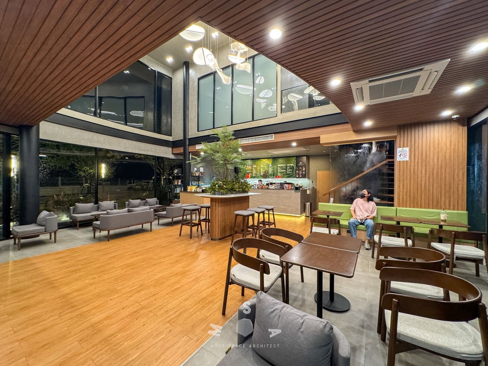 Café Amazon · Ao Noi — Seating under the timber ceiling (photograph)