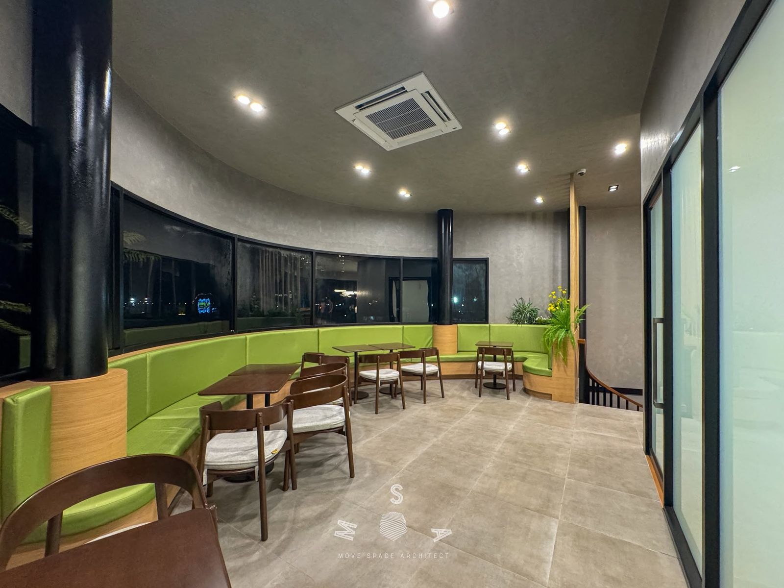 Café Amazon · Ao Noi — Curved green banquette (photograph)