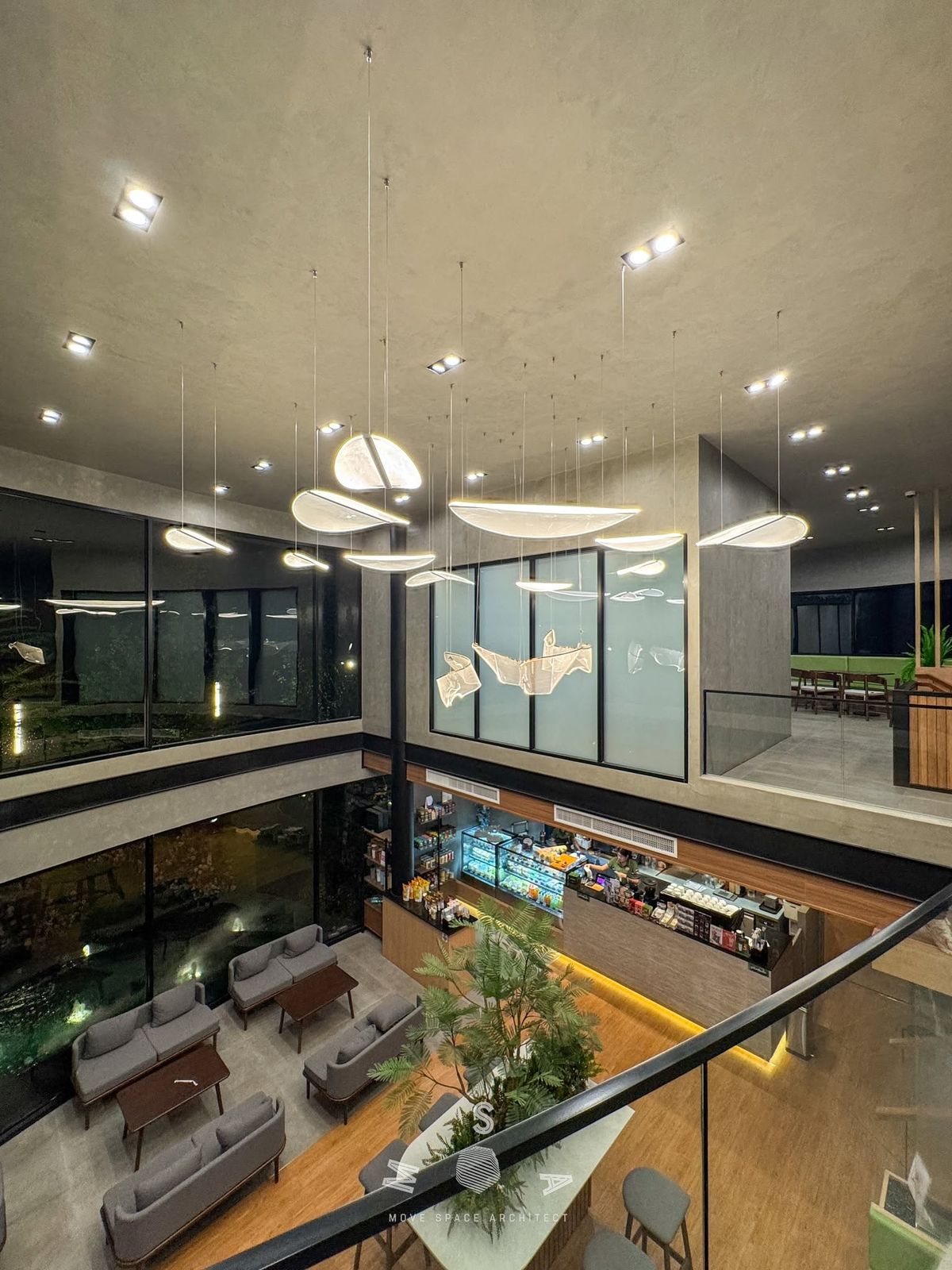Café Amazon · Ao Noi — The void seen from the mezzanine (photograph)